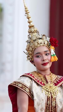 Traditional Thai Khon Dancer in Ornate Golden Costume and Headdress