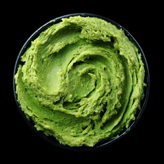 Obraz premium Spicy wasabi paste for sushi isolated on black background with clipping path, concept of condiments and seasoning