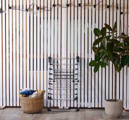 Obraz premium Colorful clothes drying on a outdoor drying rack in a sunny garden, featuring neatly hung garments, sustainable air drying, household laundry routine, eco-friendly lifestyle, fresh clean clothing, spr