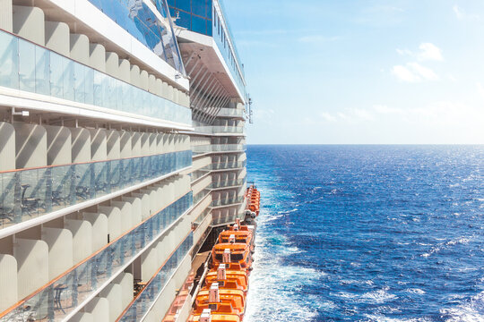 Ocean view from a cruise ship deck on a bright day