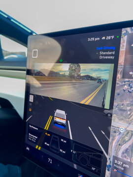 Tesla screen with navigation map and lane visualization