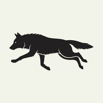 Black wolf silhouette running on a light background