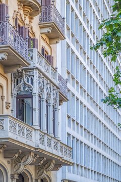 Ornate Vintage Balcony Contrasting with Modern Grid Building Facade, Classic European Architecture Style, Urban Contrast