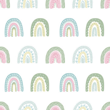 Colorful pattern with cute rainbows. Hand drawn childish rainbows seamless pattern