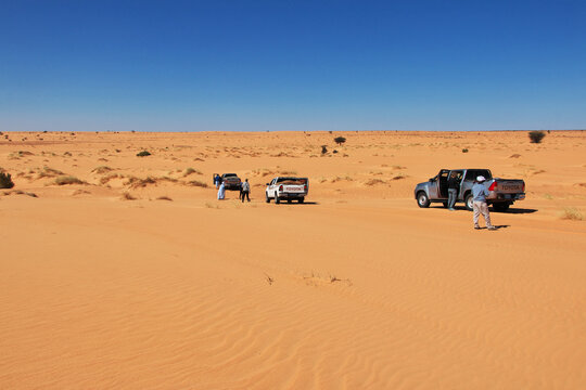 Chinguetti, Mauritania - 11 Jan 2022: Cars on sand dunes of Sahara Desert , Mauritania, West Africa