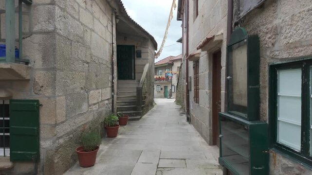 Narrow stone street in Combarro traditional village Galicia Spain