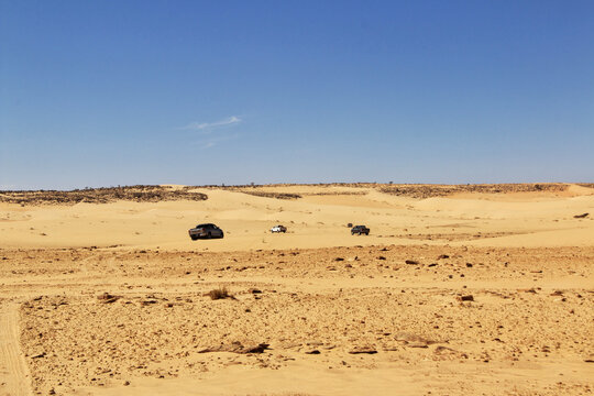 Cars on sand dunes of Sahara Desert , Mauritania, West Africa