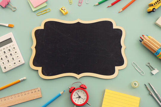 Back to school concept over pastel background. Top view