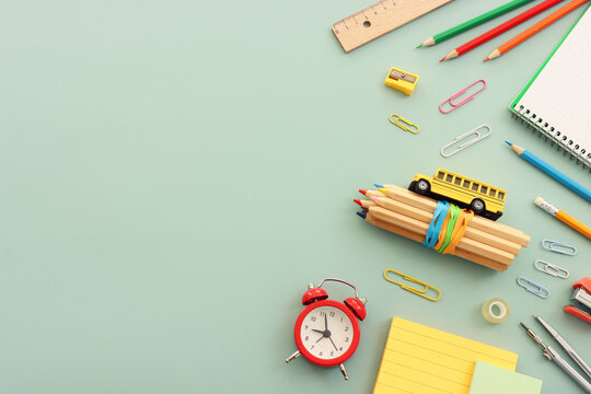 Back to school concept over pastel background. Top view