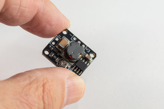Close-up Boost Module High Voltage DC-DC Step Up Converter for DIY Ion Generator in hand for arduino