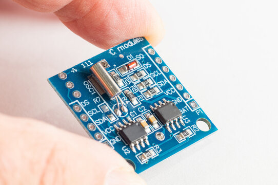 Close-up Real Time Clock Module For AVR ARM PIC Tiny RTC I2C  DS1307 Clock in hand for arduino