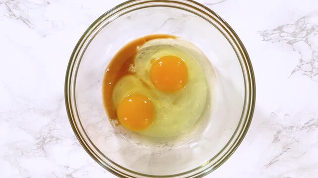 Whisking Eggs in Glass Bowl