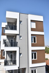 Modern Residential Apartment Building Facade Against Blue Sky © Gulnaz