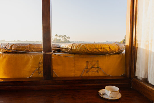 tea cup on boat, palm trees in background
