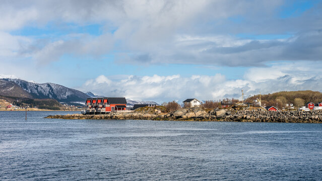 Typical red wooden houses on an island close to Hammerfest in Norway