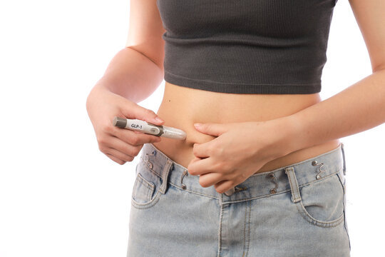 Weight loss transformation woman using injection pen for health improvement and body change with positive emotional expression