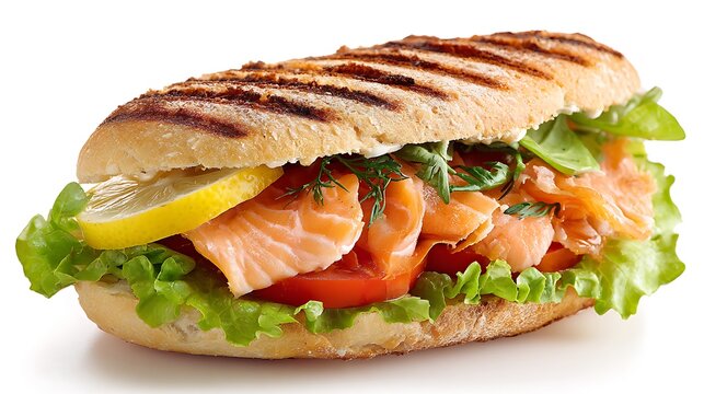 Grilled salmon panini with fresh lettuce tomato and lemon