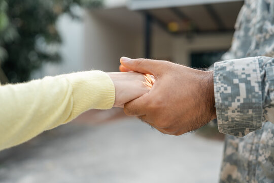 A veteran returning home from battle to see his wife and loved one embraced with affection upon meeting her. The hero, wounded while protecting his country, returned to his loved one to rest.
