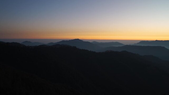 Panoramic sunrise over the Himalayan mountain range in Chakrata, Dehradun, Uttarakhand
