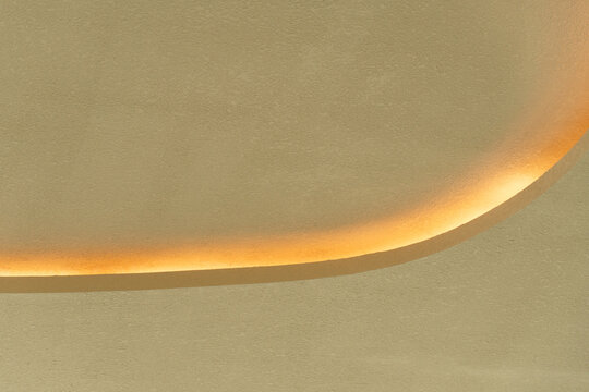 curve beige yellow cement with shadow and light wall