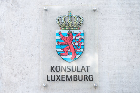 Consulate and embassy sign of Luxembourg in Trier, Germany, official coat of arms of Grand Duchy, crowned red lion, blue white striped background