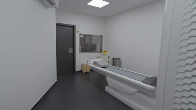 A clean, minimalist medical diagnostic room featuring a DEXA bone density scanner. Suitable for healthcare, wellness, and medical technology concepts.