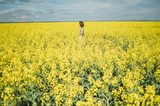 Enjoying solitude and relaxation in a summer rapeseed field