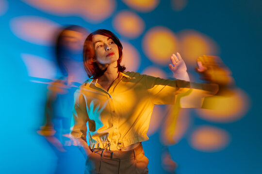 Woman indoors shows self reflection with surreal ghost effect