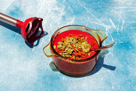 Homemade vegan beetroot soup with pumpkin seed and goji berry