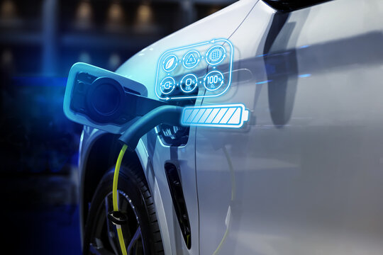 Power cable pump plug in charging power to electric vehicle EV car.