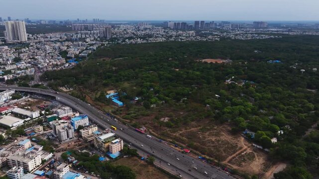 BHEL with residential buildings, flyover, vehicles and national highway 65 at Chanda nagar, ramachandrapuram, Lingampally, hyderabad, telangana, india. day time, trucking shot, drone shot, 4k.