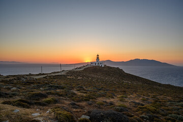 Armenistis Lighthouse on a Distant Headland at Sunset, Mykonos, Greece © Michal Plevko