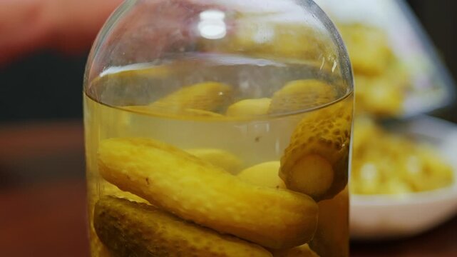 Homemade pickled cucumbers are sliced into a fresh traditional family salad