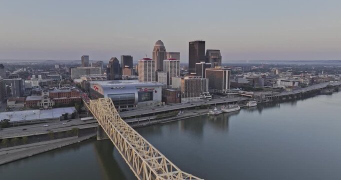 Louisville Kentucky Aerial v57 flyover second street bridge over Ohio river capturing freeway traffic, riverside arena and downtown cityscape at sunrise - Shot with Mavic 3 Pro Cine - Sept 26th 2023