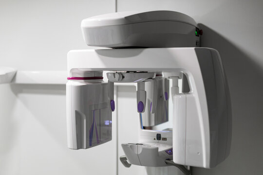 Modern dental panoramic X-ray unit in a clean clinical environment, featuring advanced digital imaging equipment for dental diagnostics