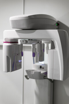 Modern dental panoramic X-ray unit in a clean clinical environment, featuring advanced digital imaging equipment for dental diagnostics