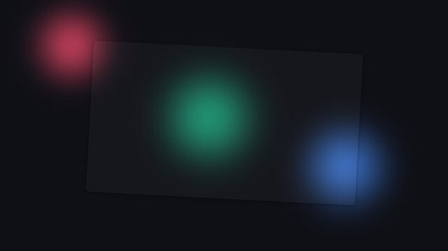 Abstract composition of glowing red green and blue light orbs on black