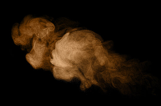 Abstract golden dust cloud explosion isolated on black background, capturing floating powder particles with dynamic motion. Ideal for luxury design, artistic texture, and creative backgrounds.