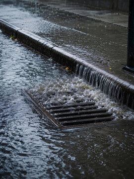 Storm Drain Overflowing During Heavy Rain and Urban Flooding