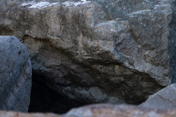 Large dark grey boulders with deep shadows and crevices © Maria