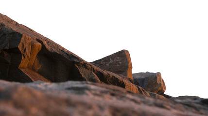 Large textured boulders with golden hour sunset lighting isolated on a transparent background. PNG file © Maria