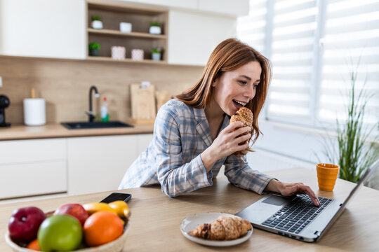 Working woman enjoys breakfast in a bright kitchen