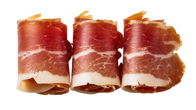 Prosciutto slices rolled up, cured meat with fat marbling