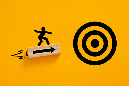 Stick figure riding rocket block moving towards target