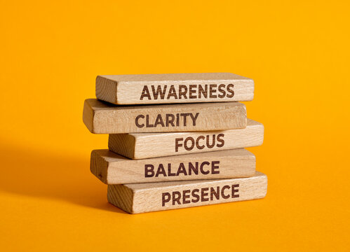 Wooden blocks presenting concepts of mindfulness.