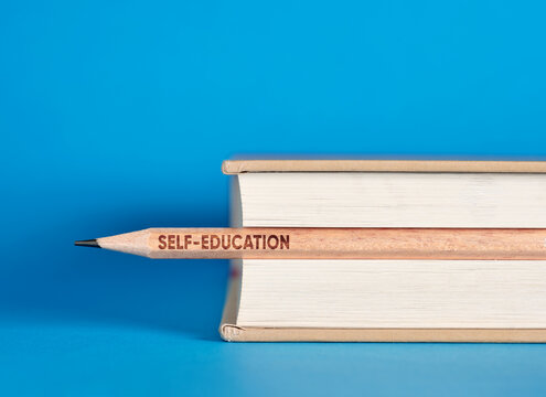 Self education pencil pushing through knowledge books