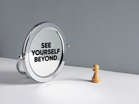 Chess pawn seeing self beyond mirror