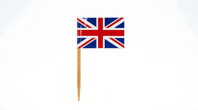 Small United Kingdom flag on a wooden toothpick isolated on white background