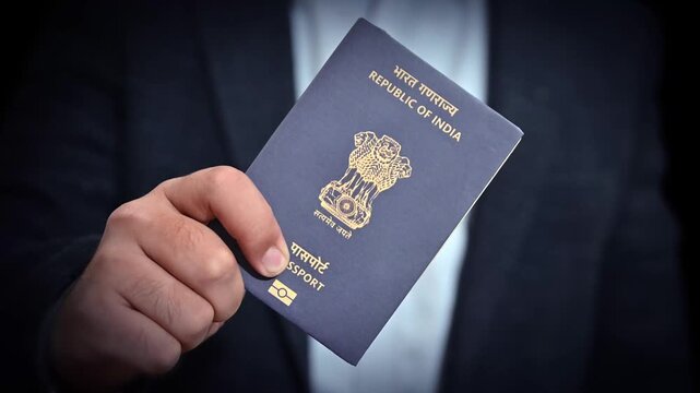 A person showing indian passport in hand, close up, 4k footage. traveling concept