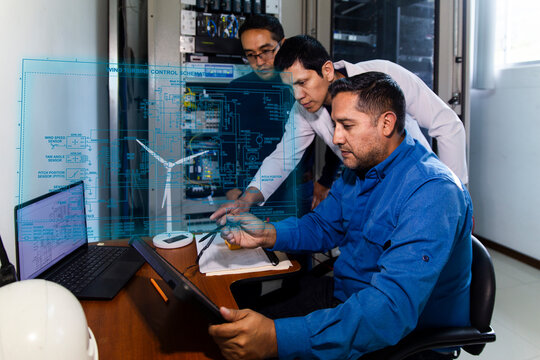 Engineers monitor a holographic electrical grid in a control room